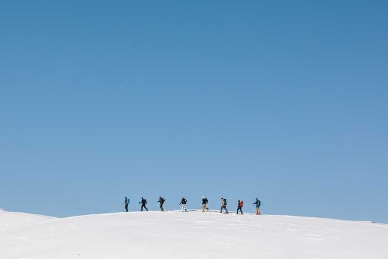 Eight friends lined up on the horizon skinning to their next objective